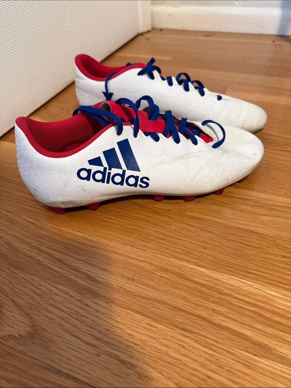 adidas women’s  White Soccer Cleats with Red & Blue Details